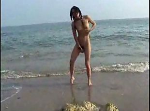 Sexy outdoor naked girlfriend posing on the beach