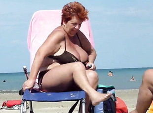 Sexy Big titted grandma in bikini at the beach